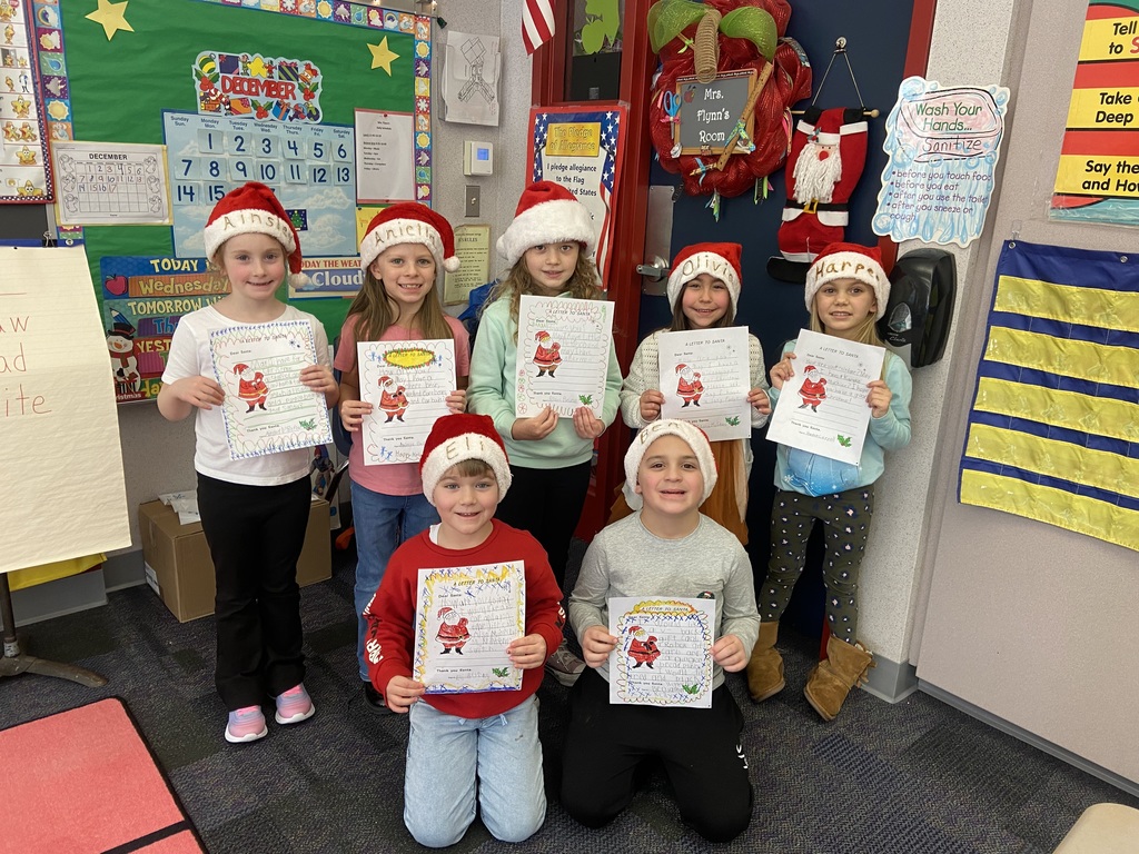 A group of students doing holiday festivities in their classroom. 