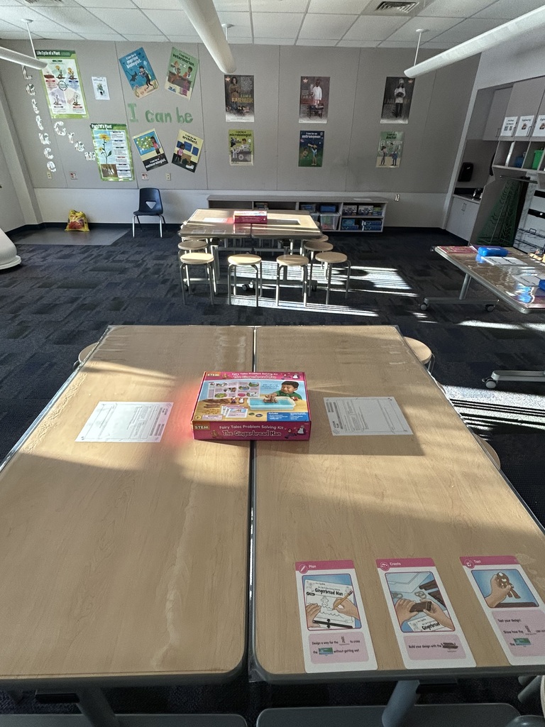 An empty stem lab showing tables with gingerbread stem activities.  