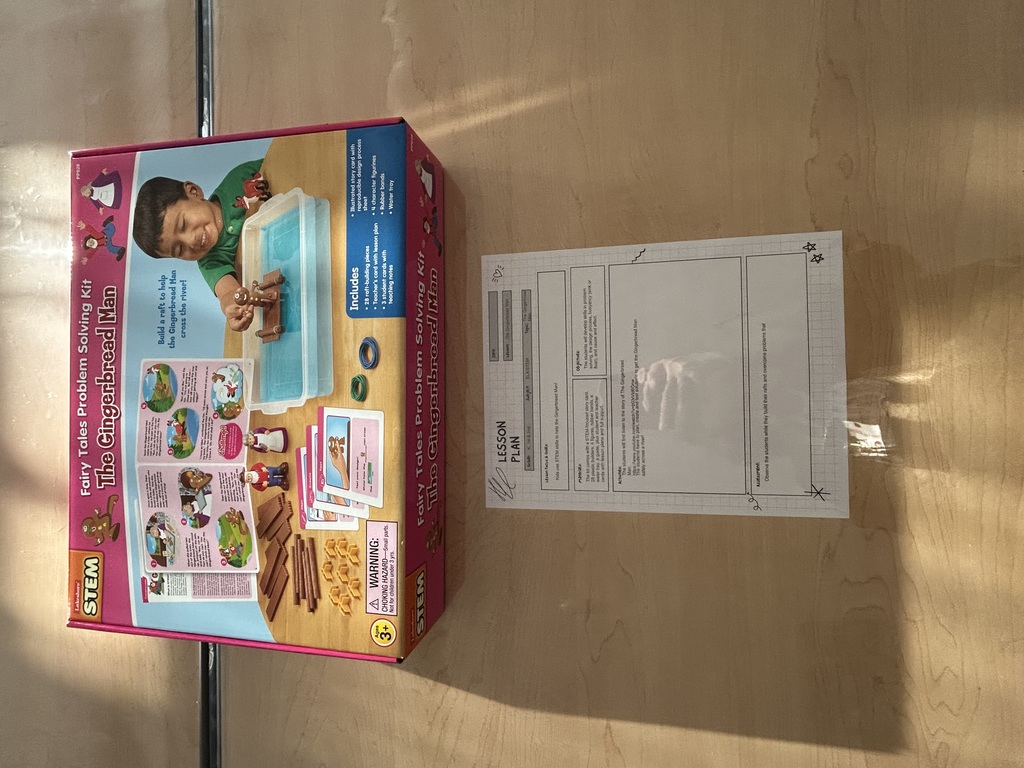 An empty stem lab showing tables with gingerbread stem activities.  