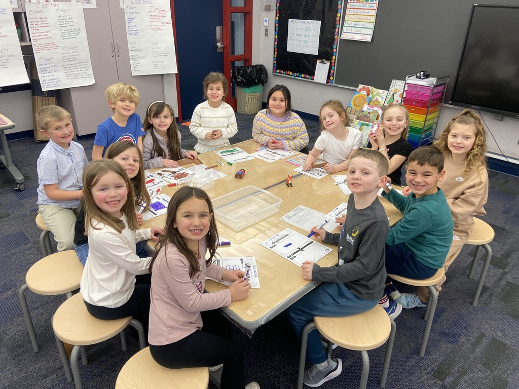 Students seated at a table in the stem lab