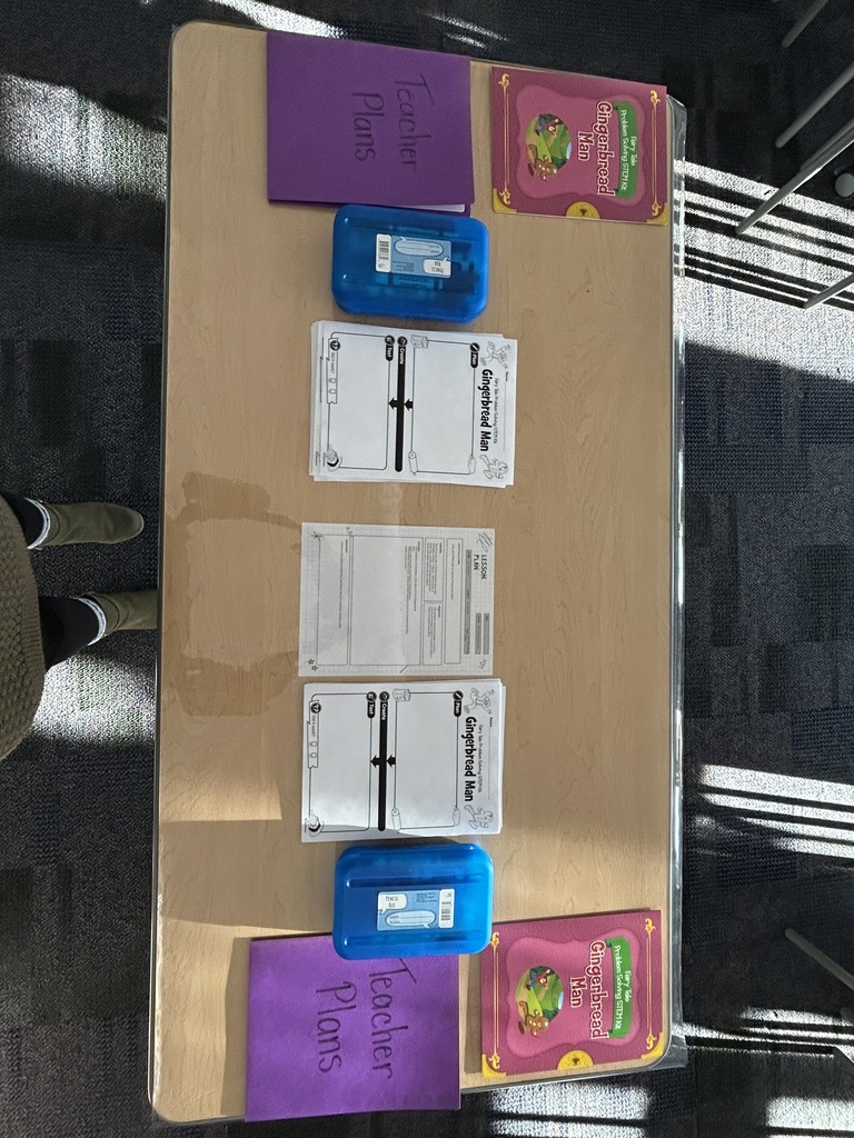 An empty stem lab showing tables with gingerbread stem activities.  