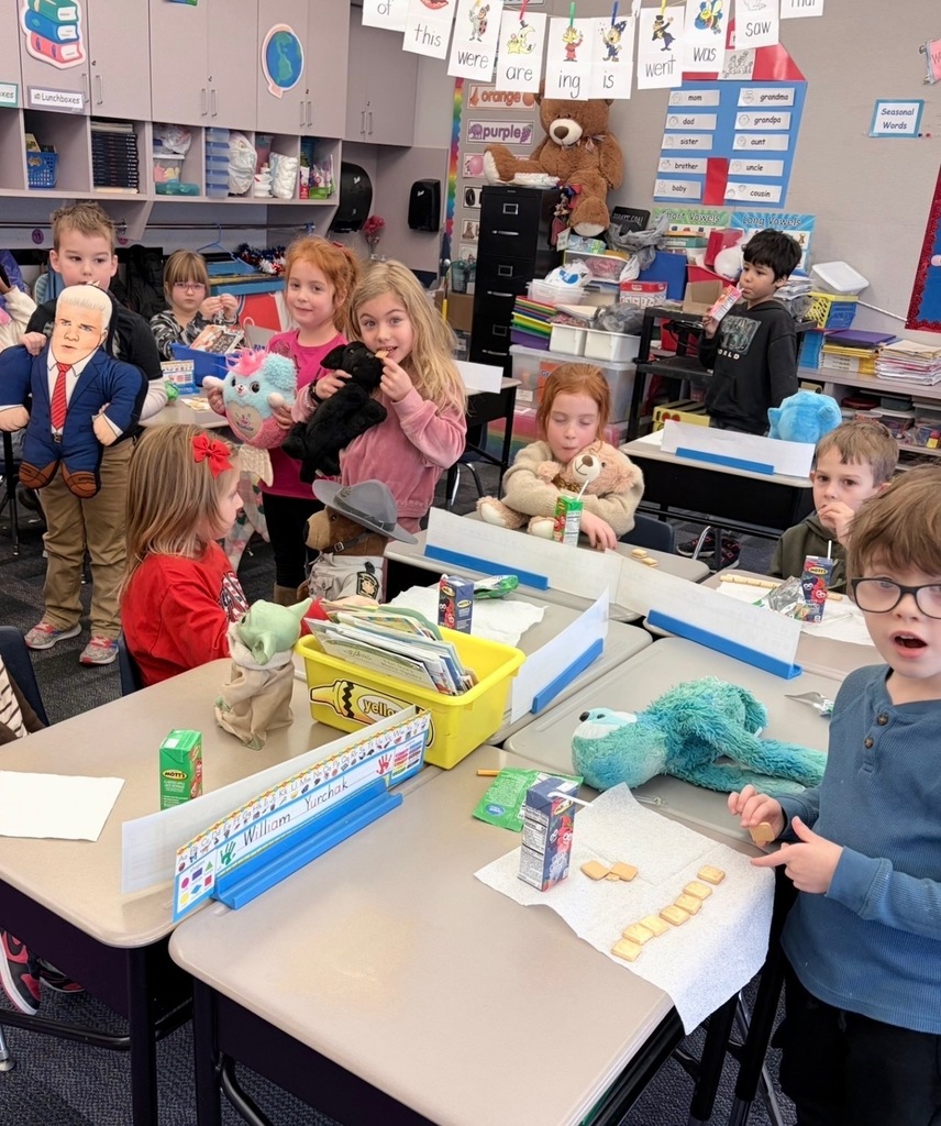 Kindergarten students with stuffed teddy bears 