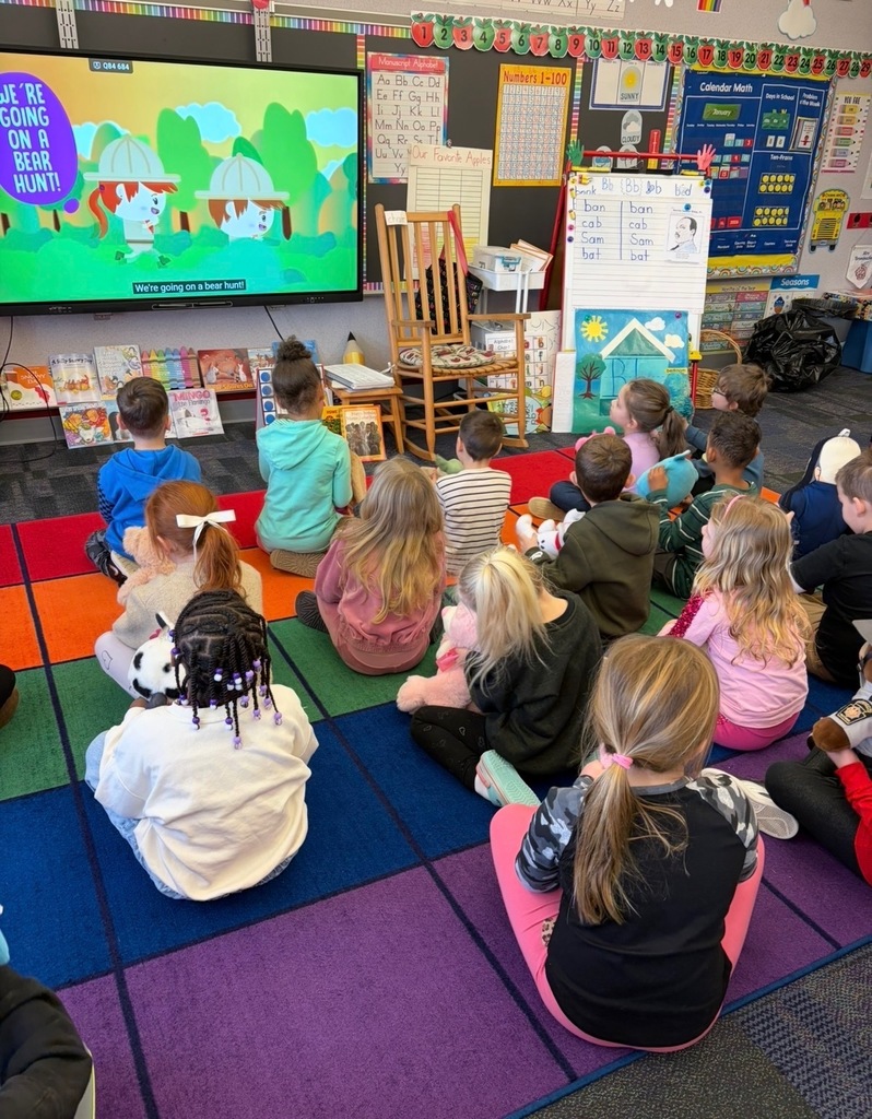 Kindergarten students with stuffed teddy bears 