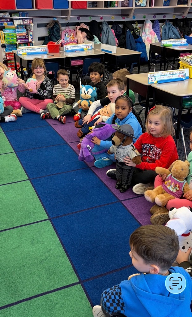 Kindergarten students with stuffed teddy bears 
