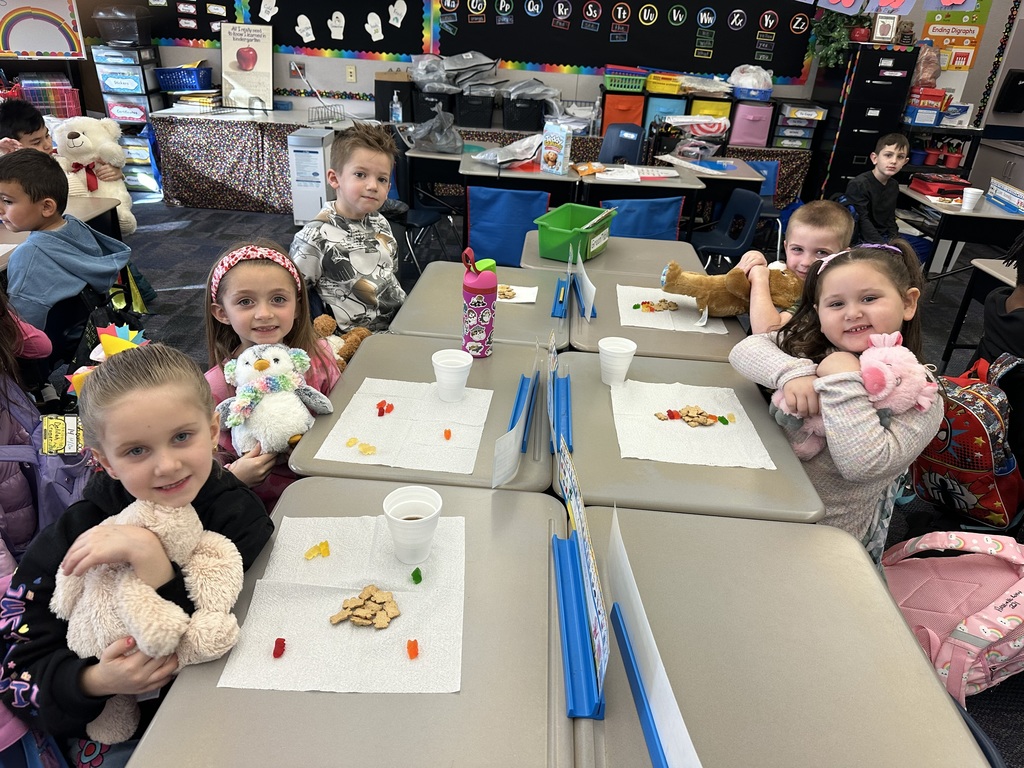Kindergarten students with stuffed teddy bears 
