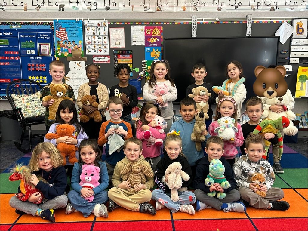 Kindergarten students with stuffed teddy bears 