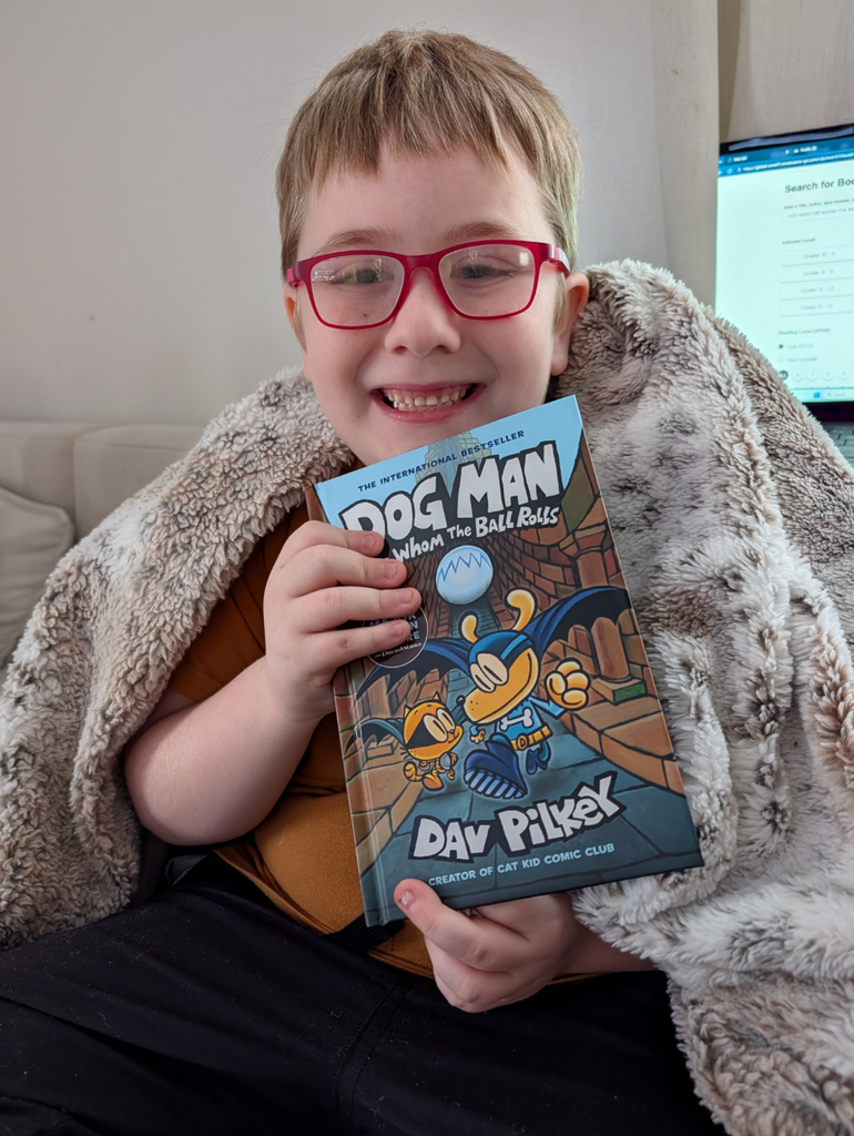 A student holding a book