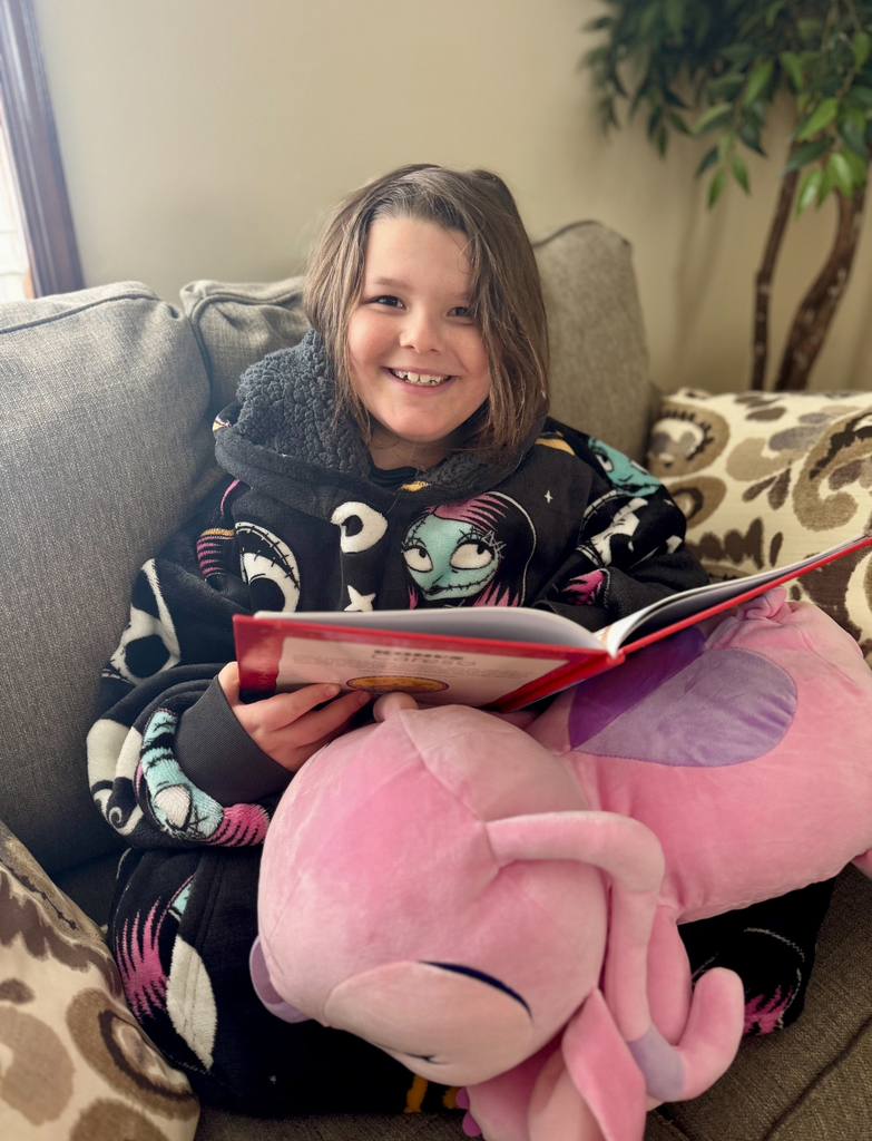 A student holding a book