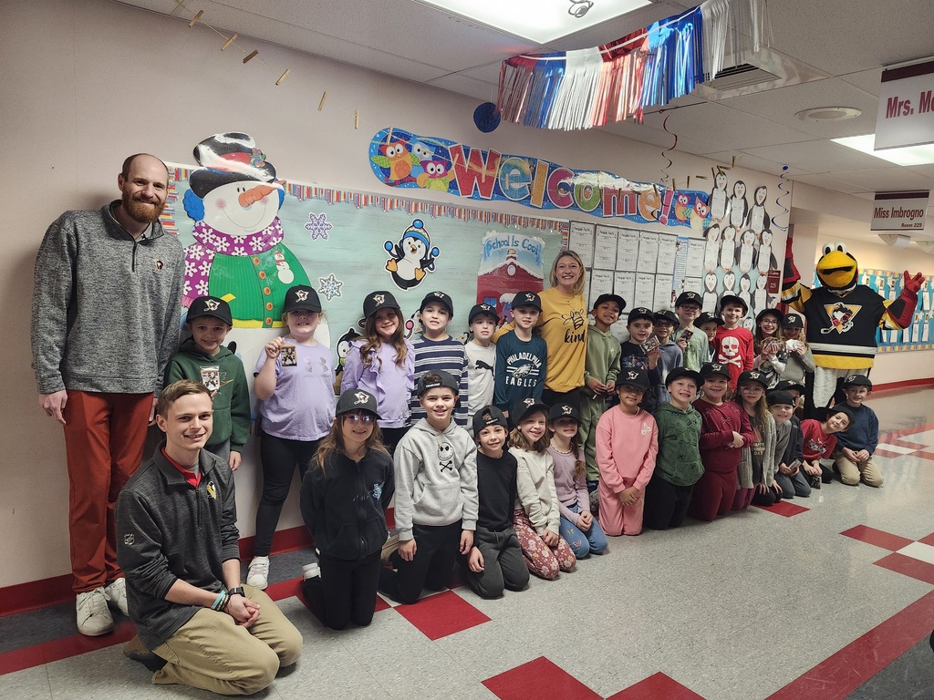 Mrs. Melvin’s 2nd grade class in a group photo with penguin mascot