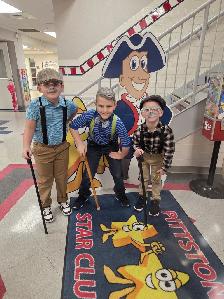 Three boys dressed as old men.