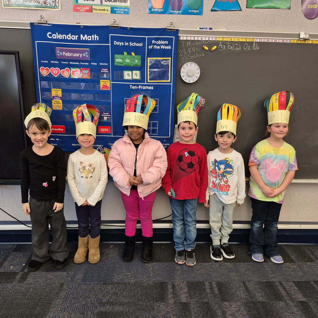 A group of kindergarten students wearing 100 day crowns
