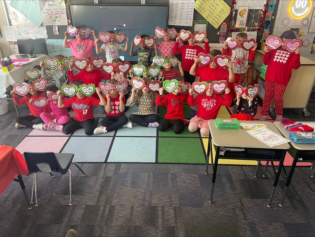 Students with a valentine craft