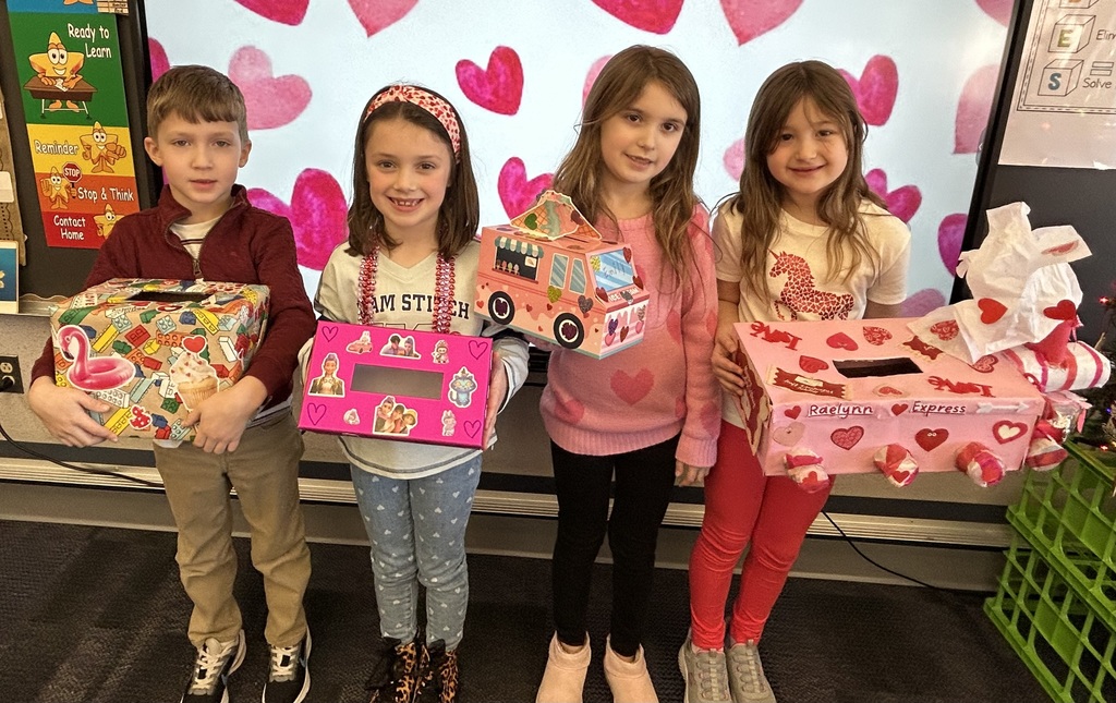 Students with valentine card box crafts