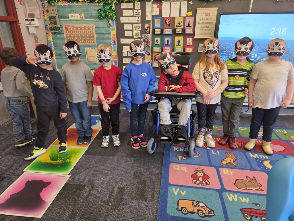 A group of students with zebra masks