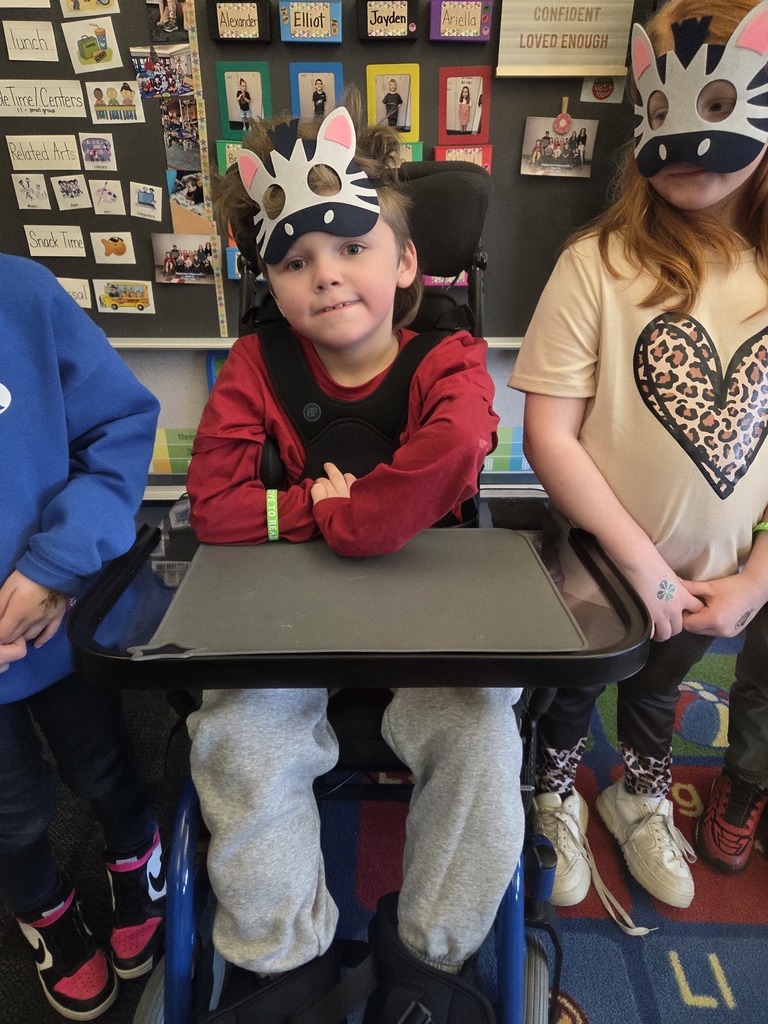 A group of students with zebra masks