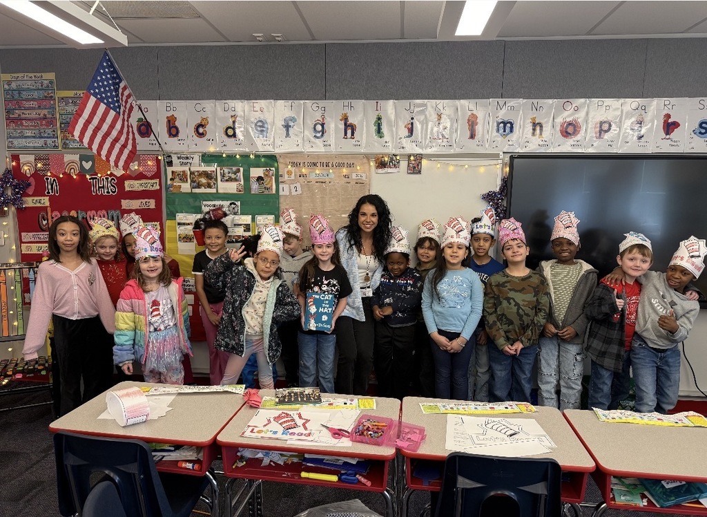 A group of students posing with silly hats
