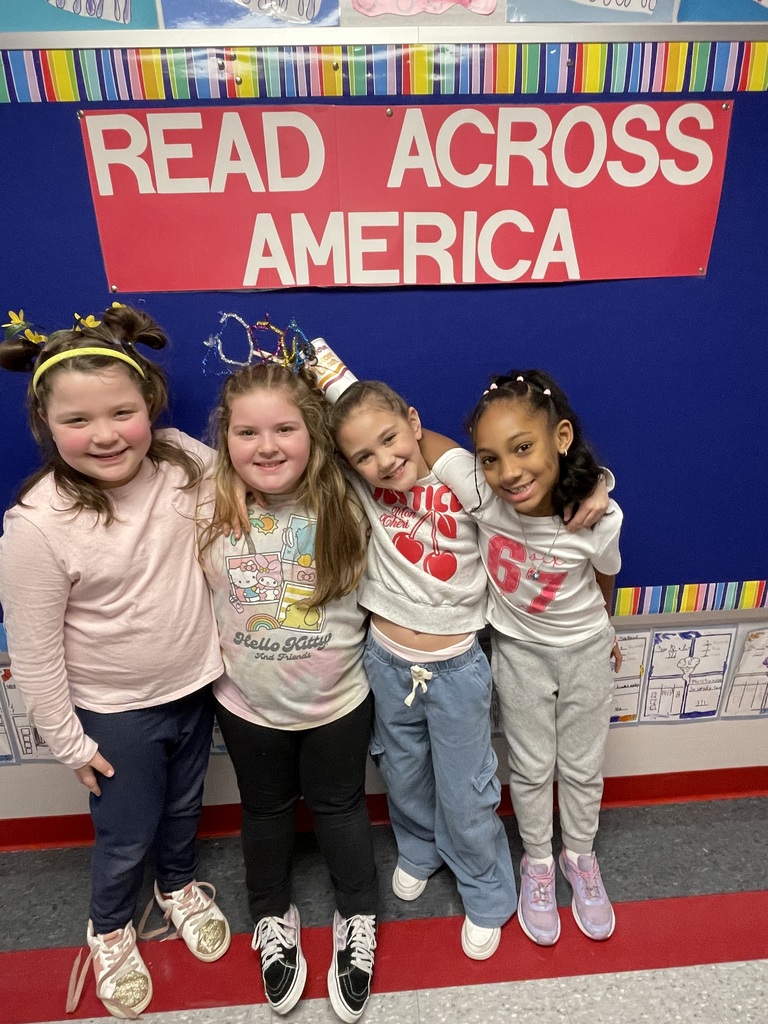 A group of students posing with silly hats