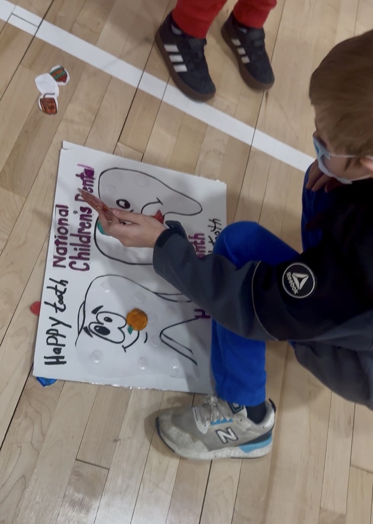 A student completing a dental health activity.