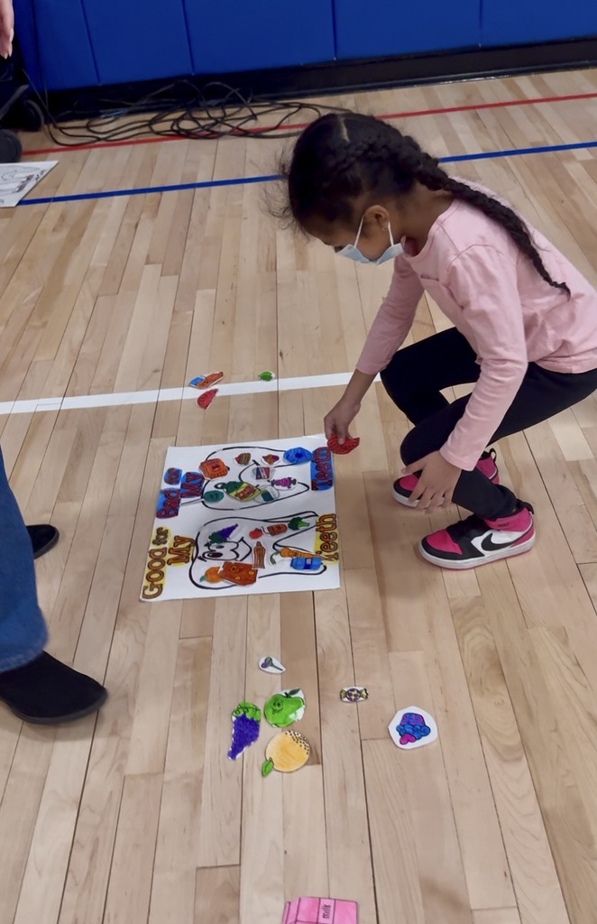 A student playing a healthy tooth game.