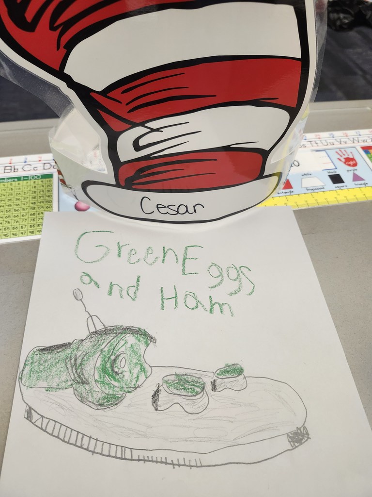Green eggs and ham and drawing on white paper