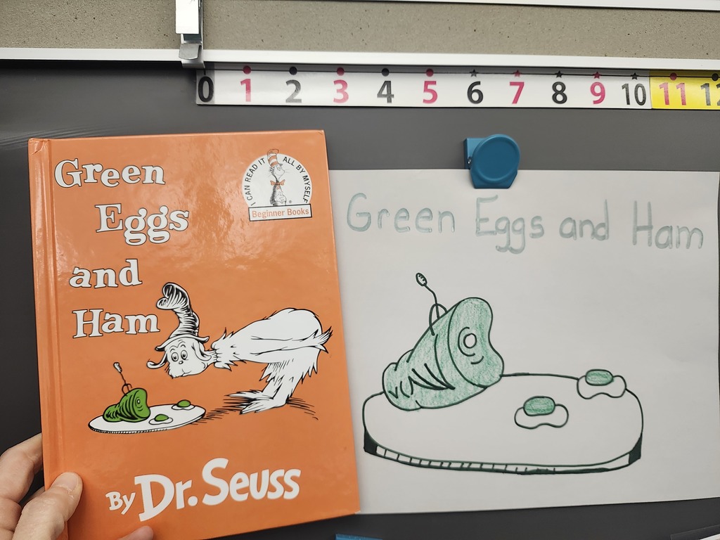 Green eggs and ham and drawing on white paper