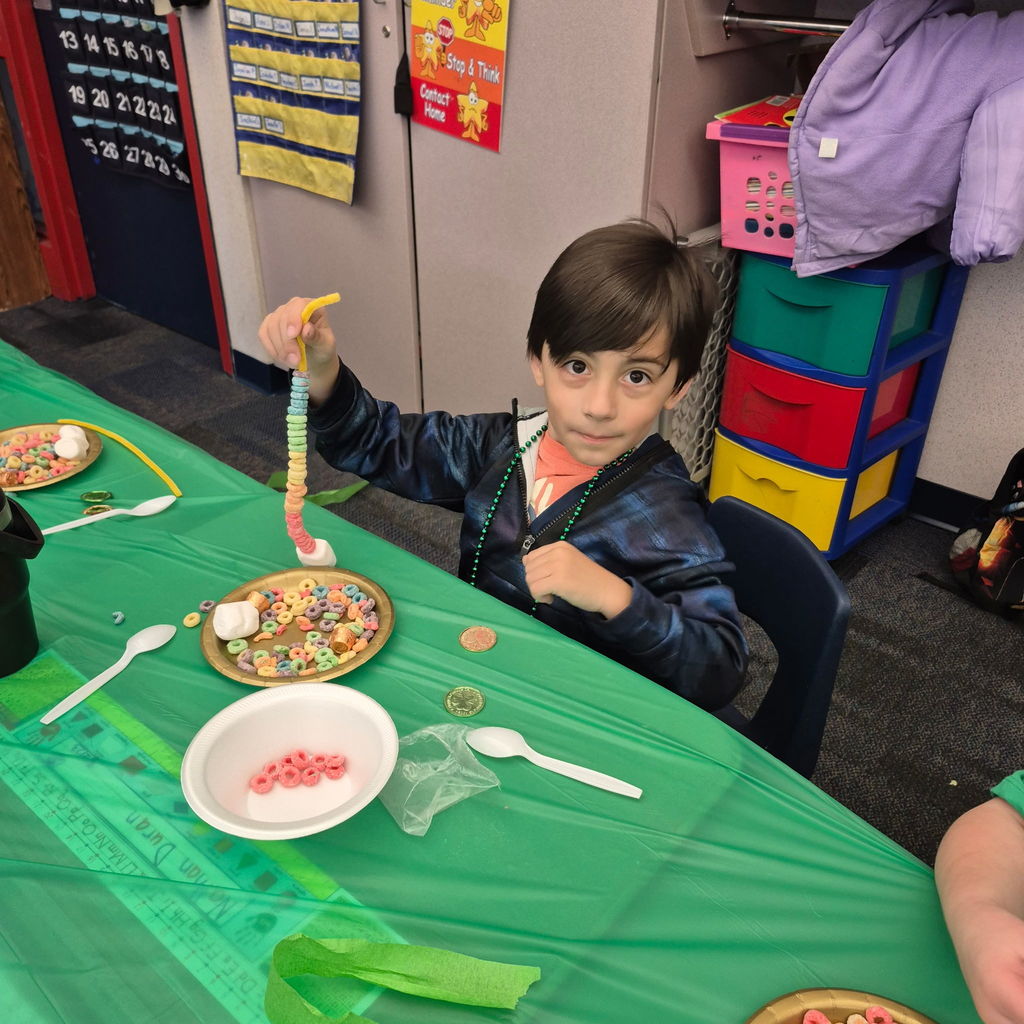 Students making a fruit loop rainbow