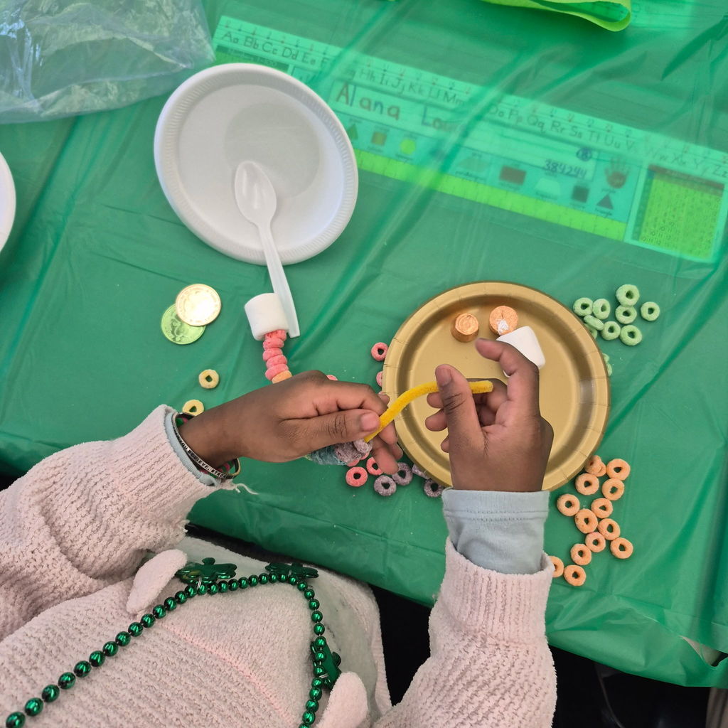 Students making a fruit loop rainbow