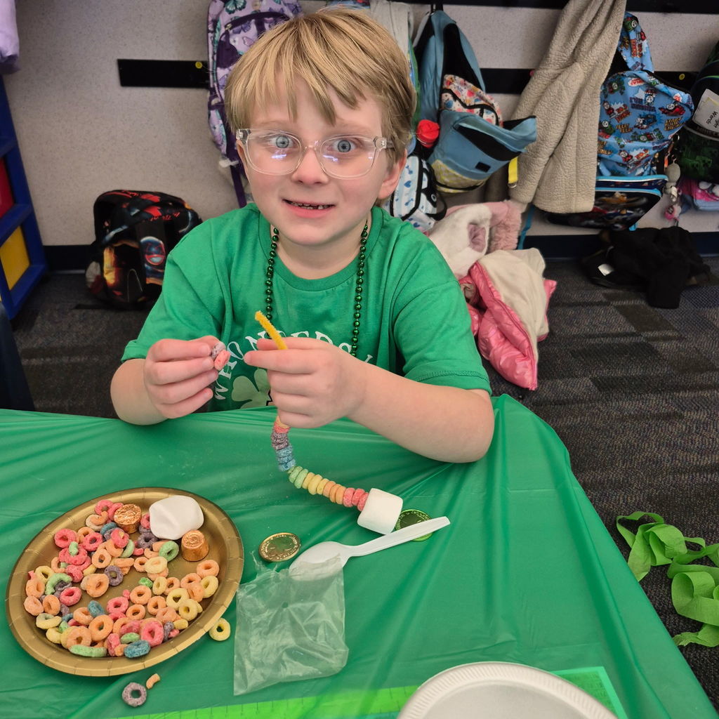 Students making a fruit loop rainbow