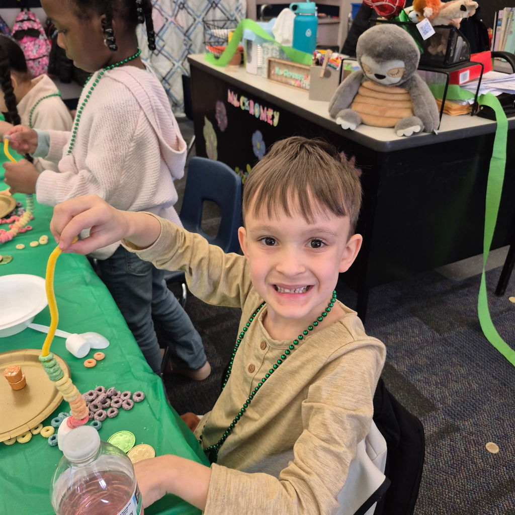 Students making a fruit loop rainbow