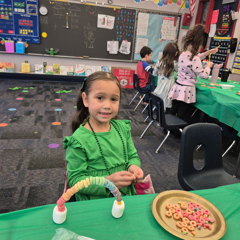 Students making a fruit loop rainbow
