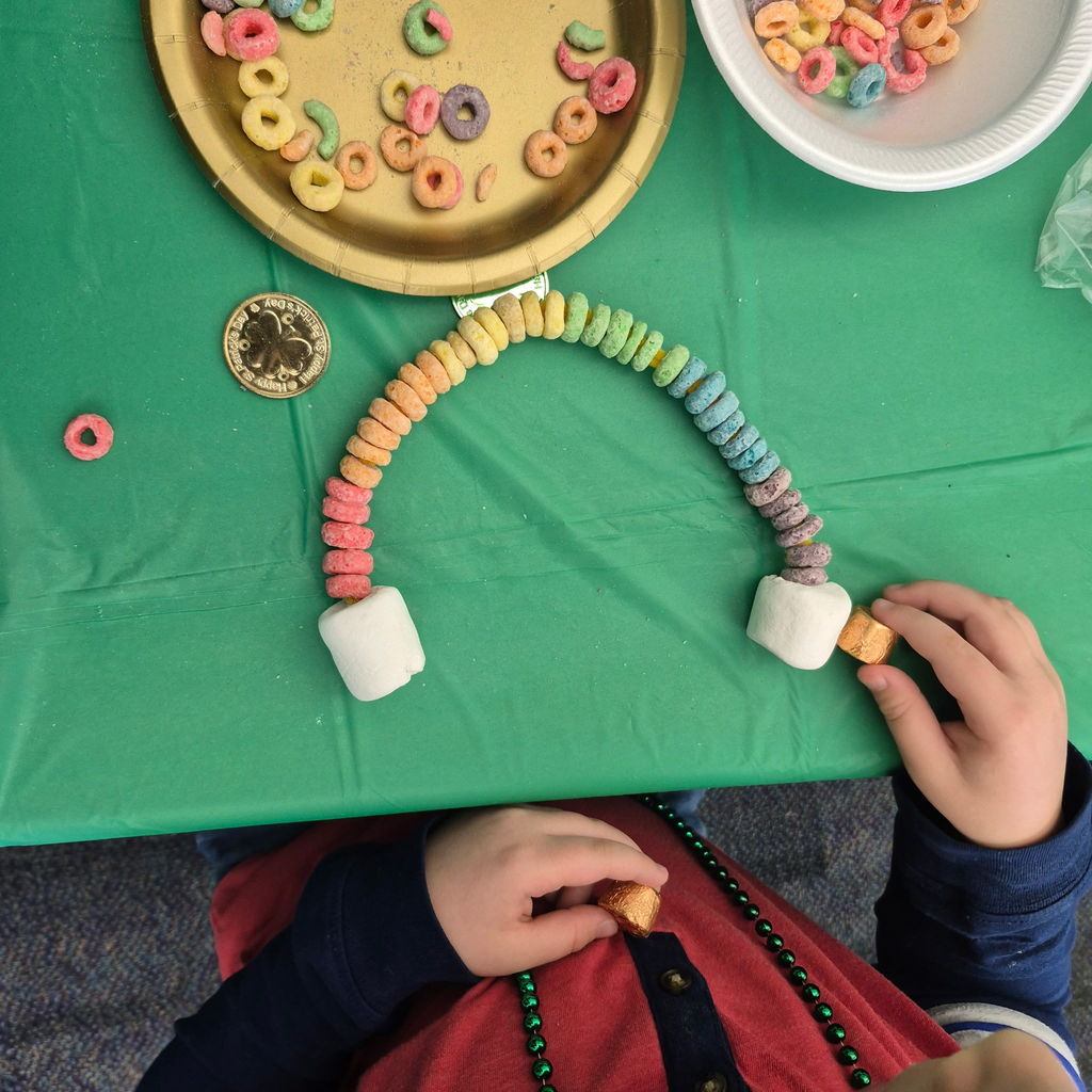 Students making a fruit loop rainbow