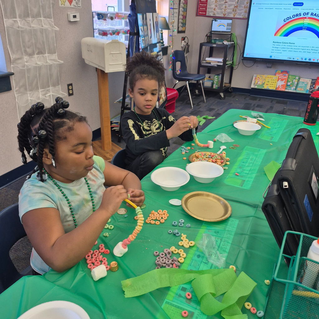 Students making a fruit loop rainbow