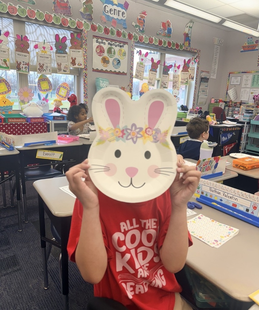 A student with a bunny plate covering their face. 