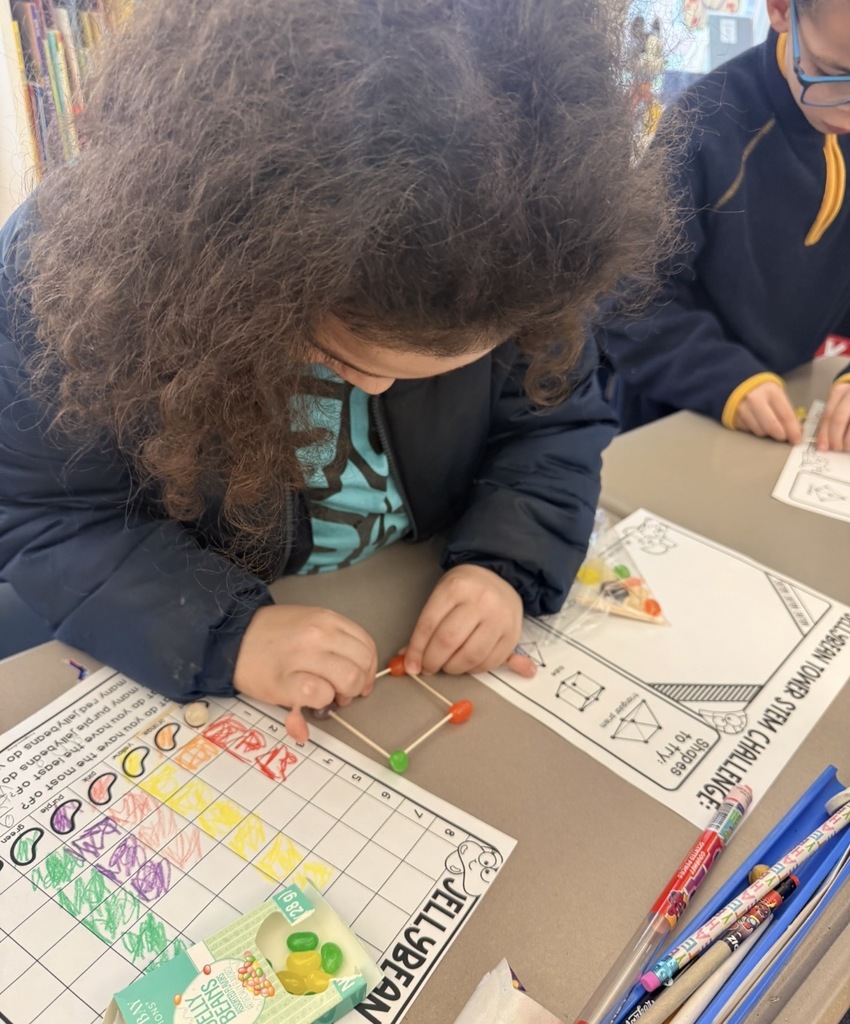 A students building jelly bean structures 