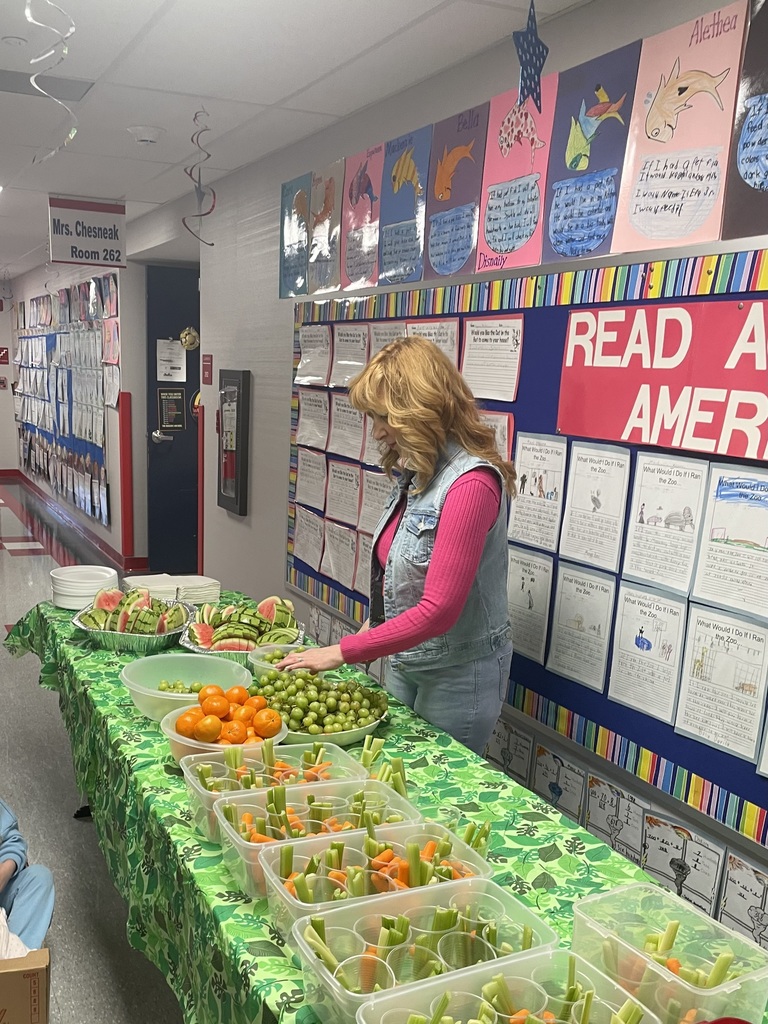An assortment of snacks on a green table cloth.