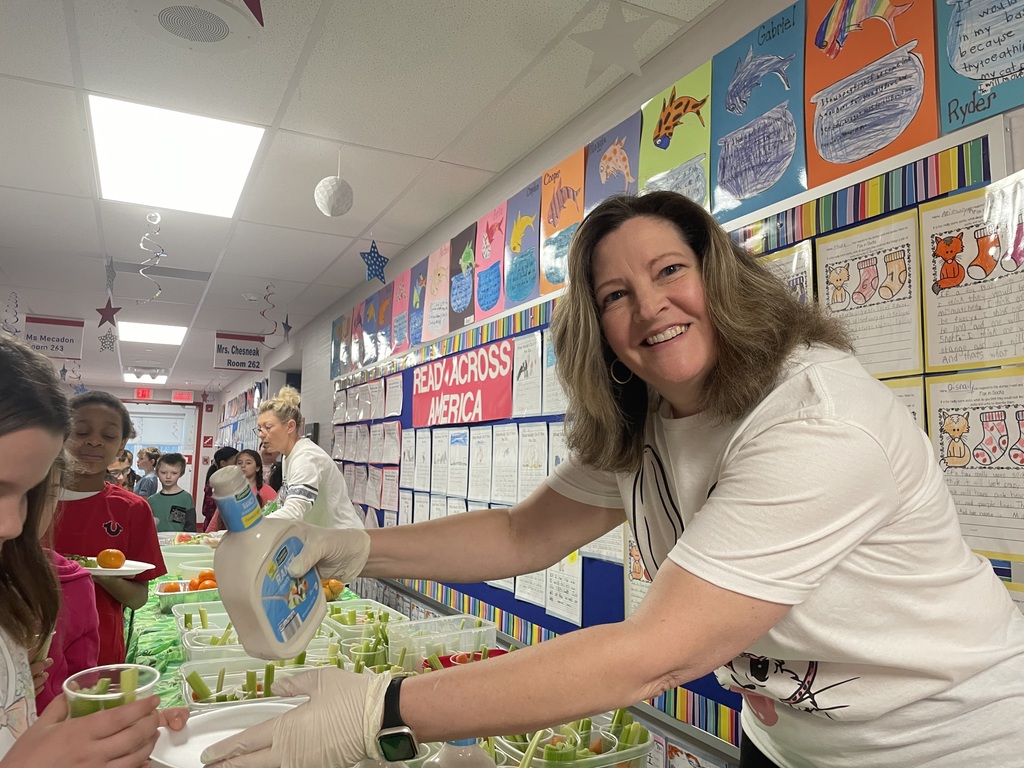 An assortment of snacks on a green table cloth.