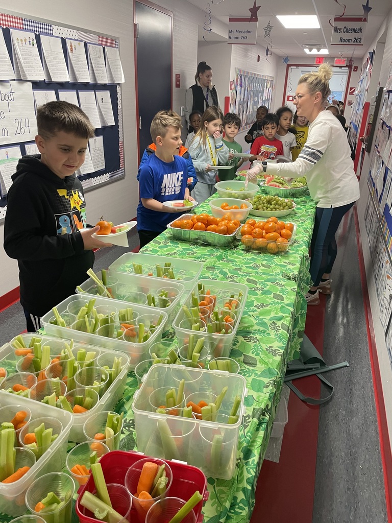 An assortment of snacks on a green table cloth.