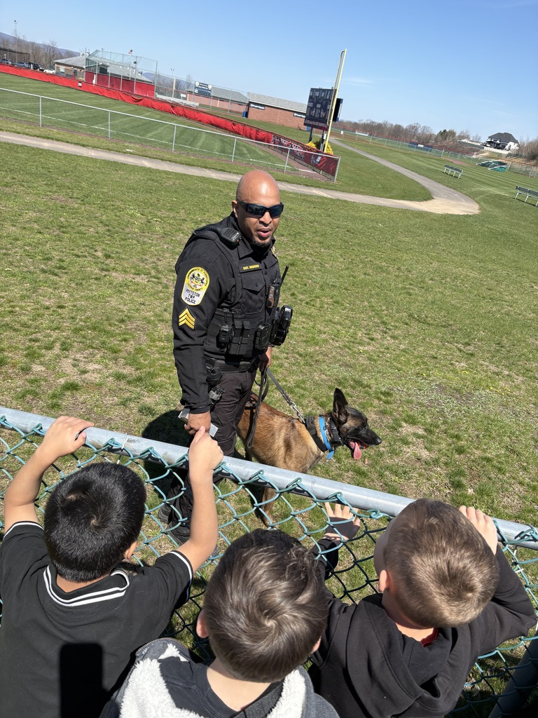A police officer outside with a police dog