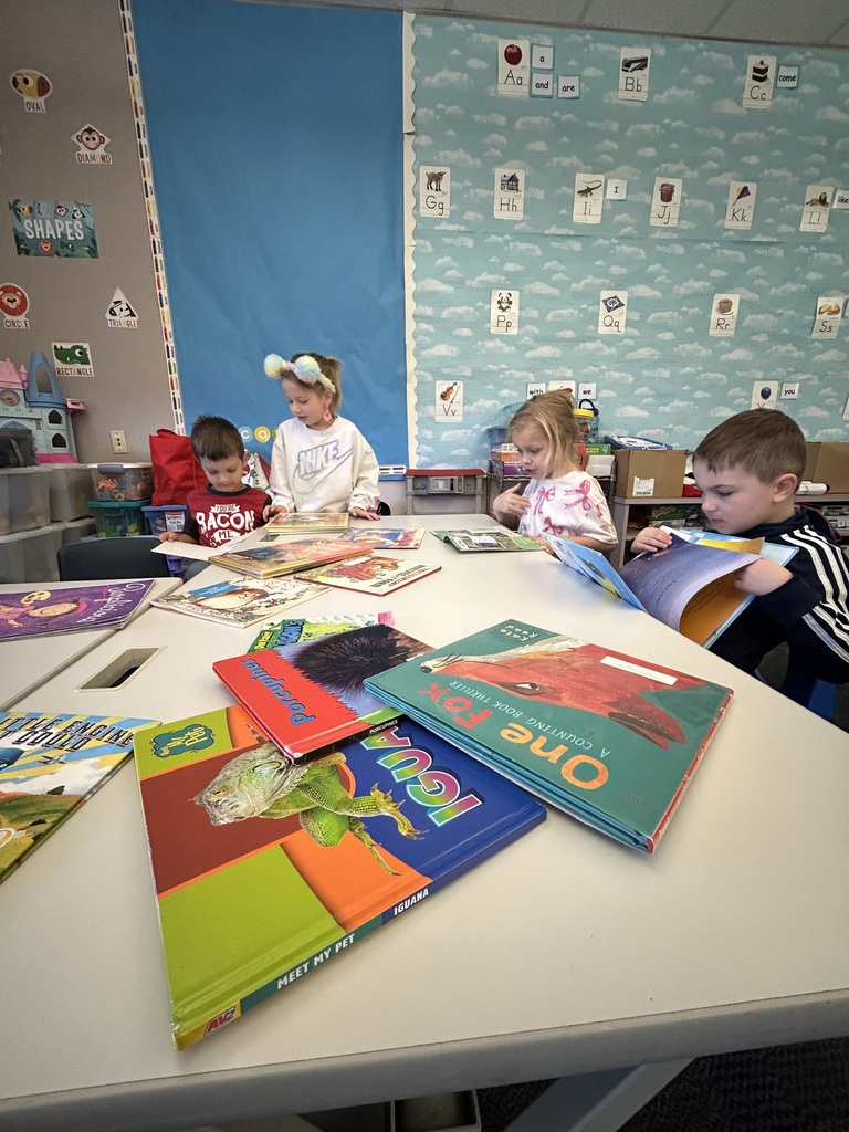 Students working with literacy materials in a kindergarten classroom. 