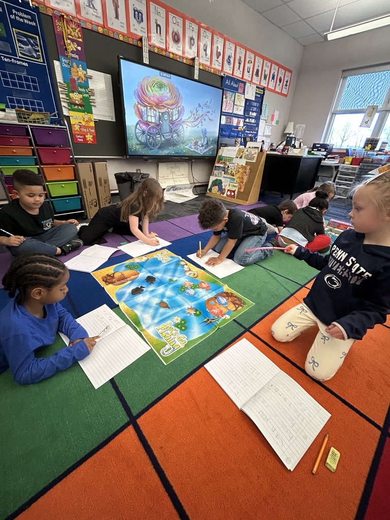 Students working with literacy materials in a kindergarten classroom. 
