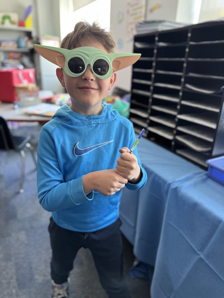A student celebrating star wars day. 