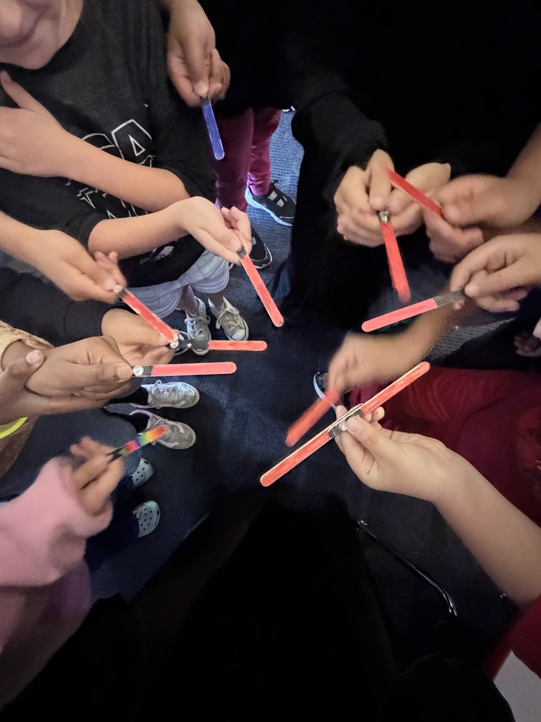 Students with popsicle light sabers 