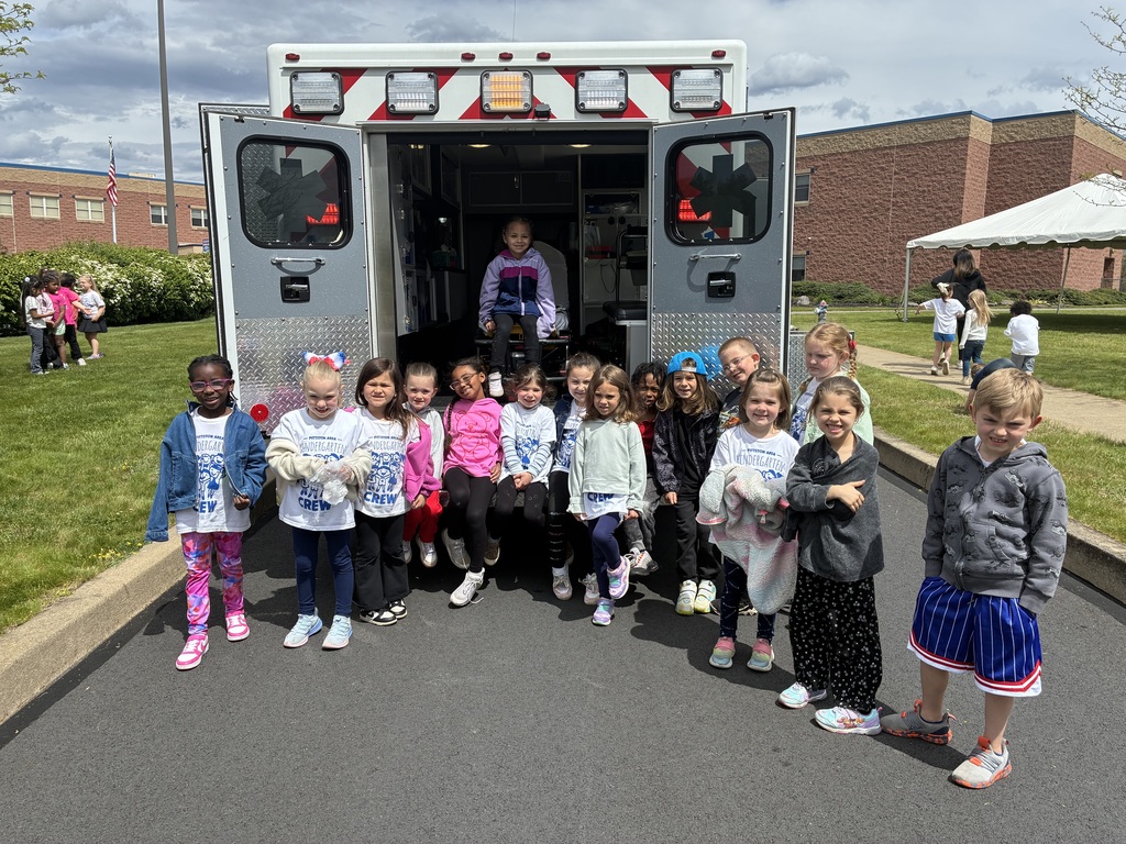 Students posing in the back of an ambulance. 
