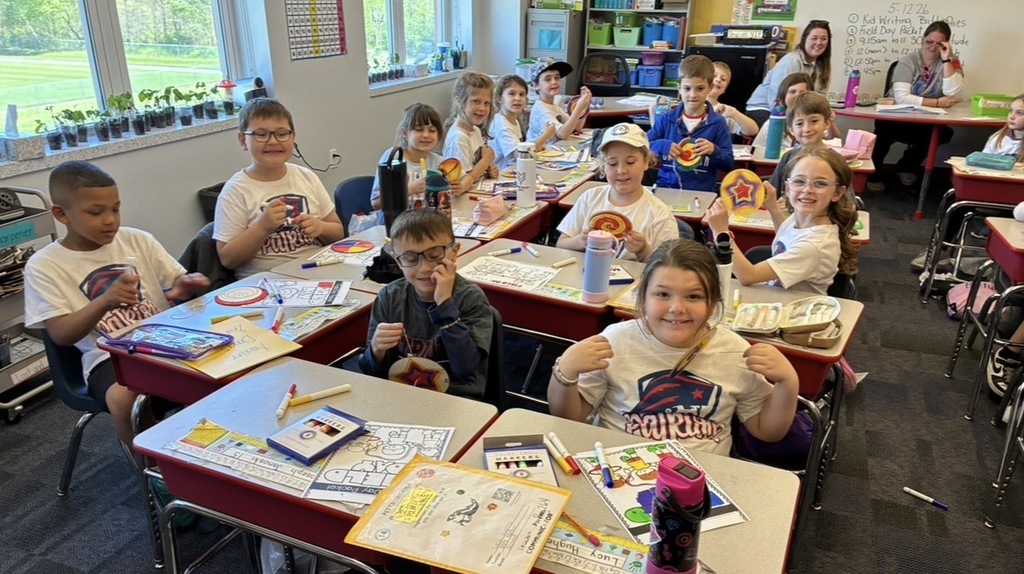 Students at field day making a color spinner. 