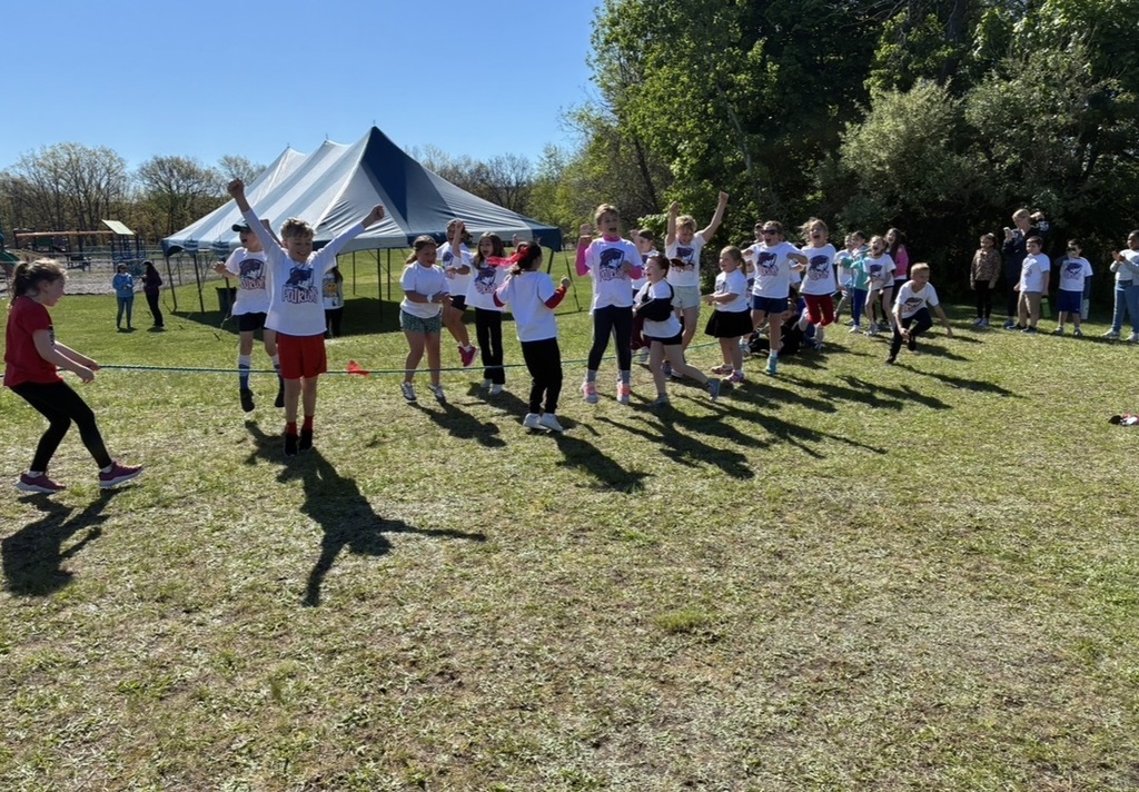 Students at field day playing tug a war. 