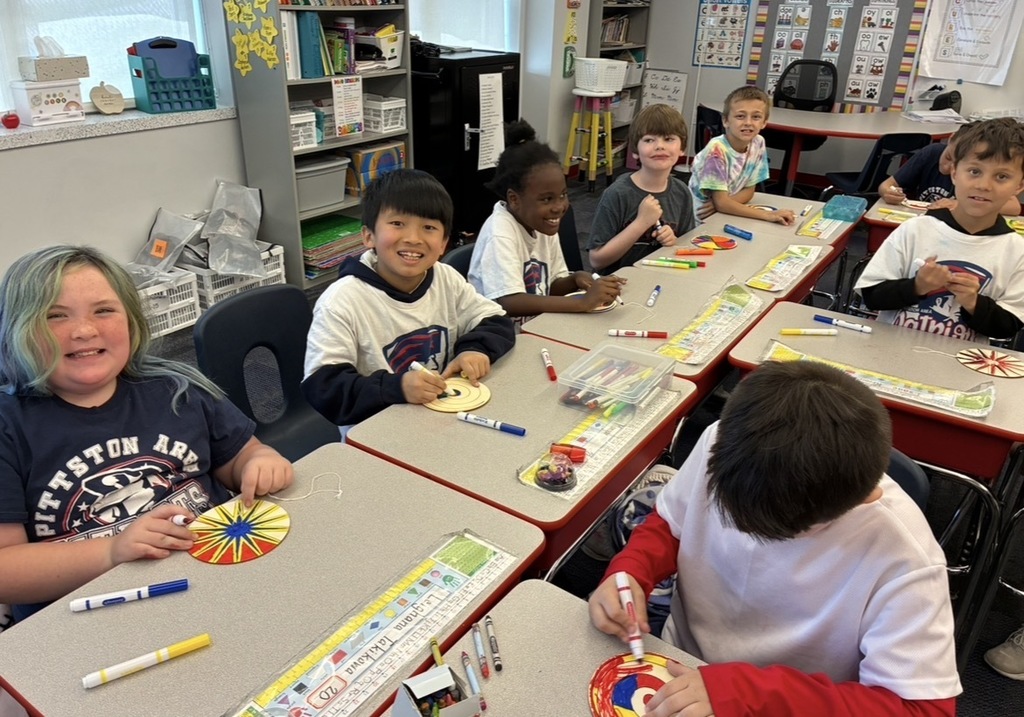 Students at field day making a color spinner. 