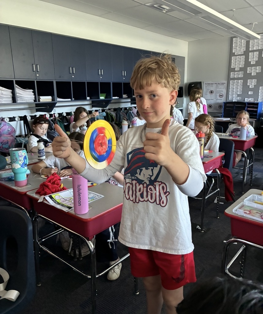 Students at field day making a color spinner. 