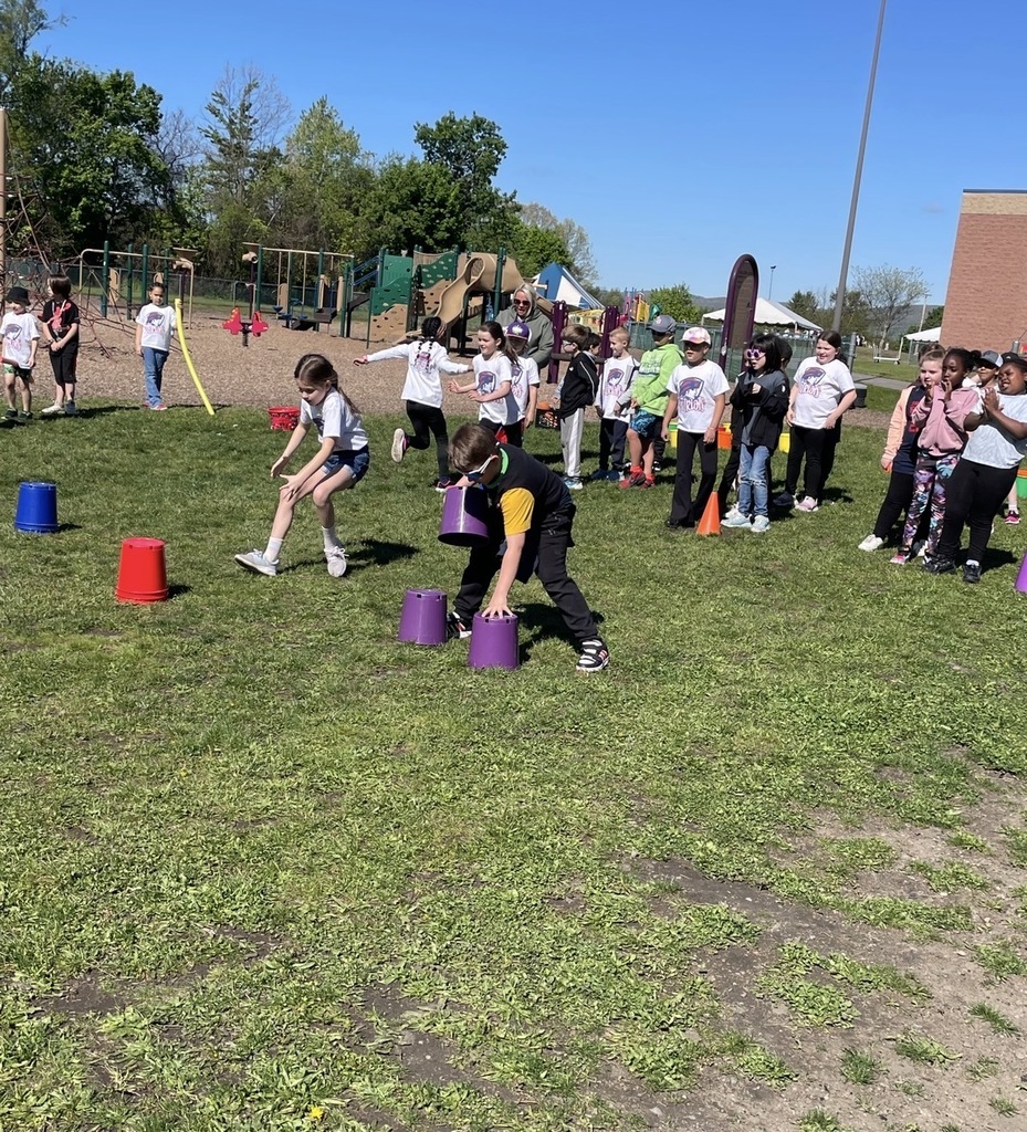 Students at field day stacking cups. 