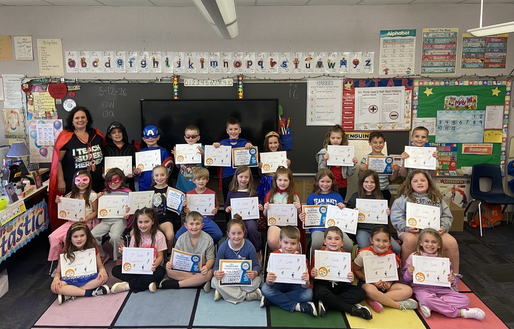 Flynn’s class holding self authored book 