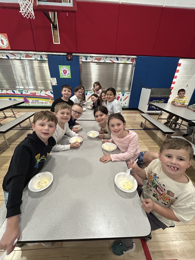 Students at an ice cream social in the cafeteria 